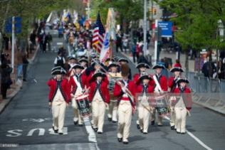 Philadelphia, PA, USA - Apr. 19, 2017; Parade leads officials, members of Color Guards and re-enactors from Independence Hall, towards the official opening and ribbon cutting ceremony of the Museum of the American revolution, in Philadelphia, PA. The new multimillion dollar attraction, featuring 32,000 square feet of exhibits, opened its doors to the general public in April 2017, and is located in Philadelphia's historic district, blocks from Independence Hall.
